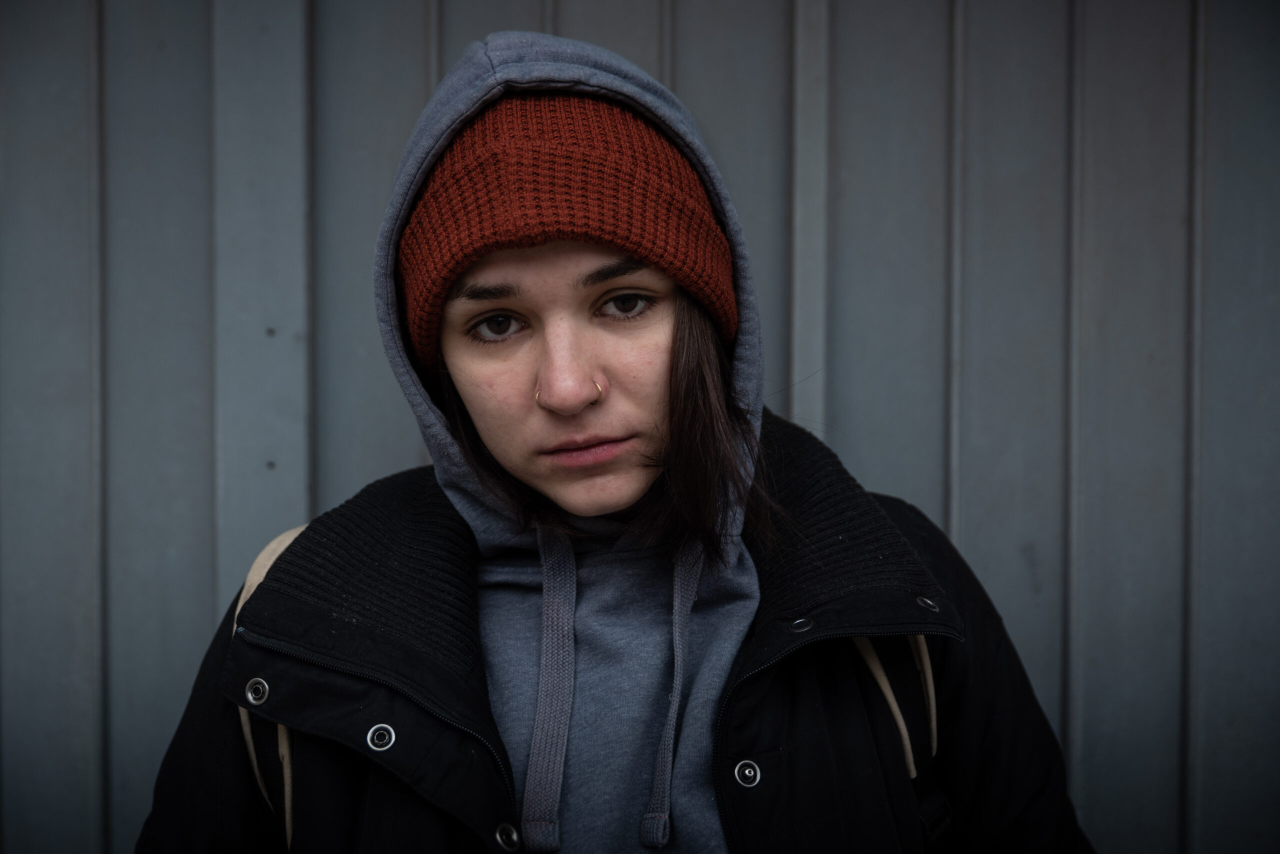 Young homeless woman looking sad